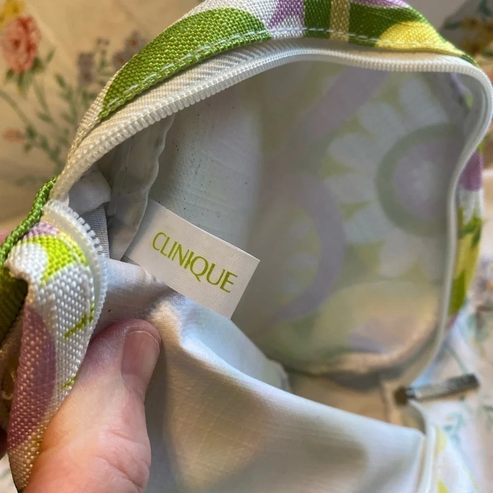Clinique NWOT cosmetic bag. Green, yellow, purple and white. White inside